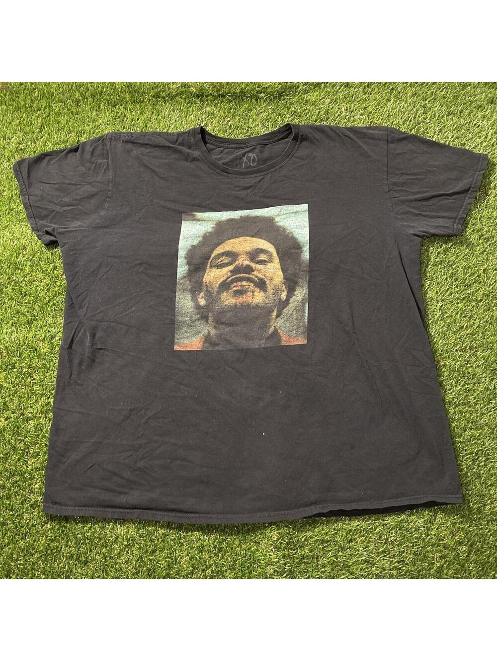The weekend XO After Hours Tour Black graphic tee with a cool design
